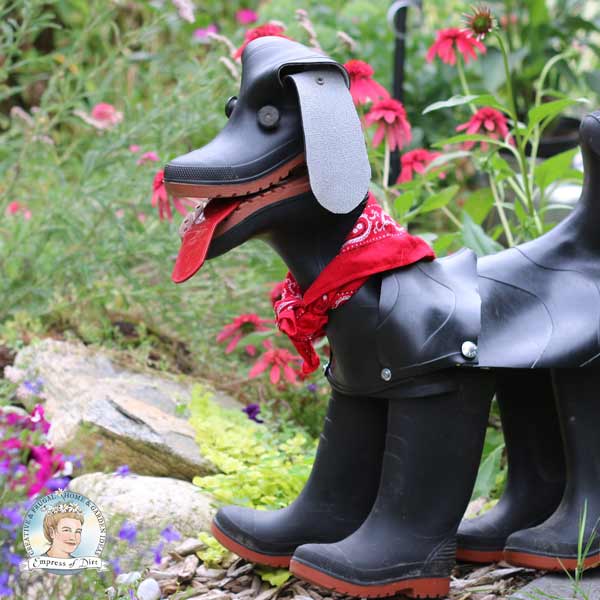 Rubber boot dog wearing red bandana scarf. 