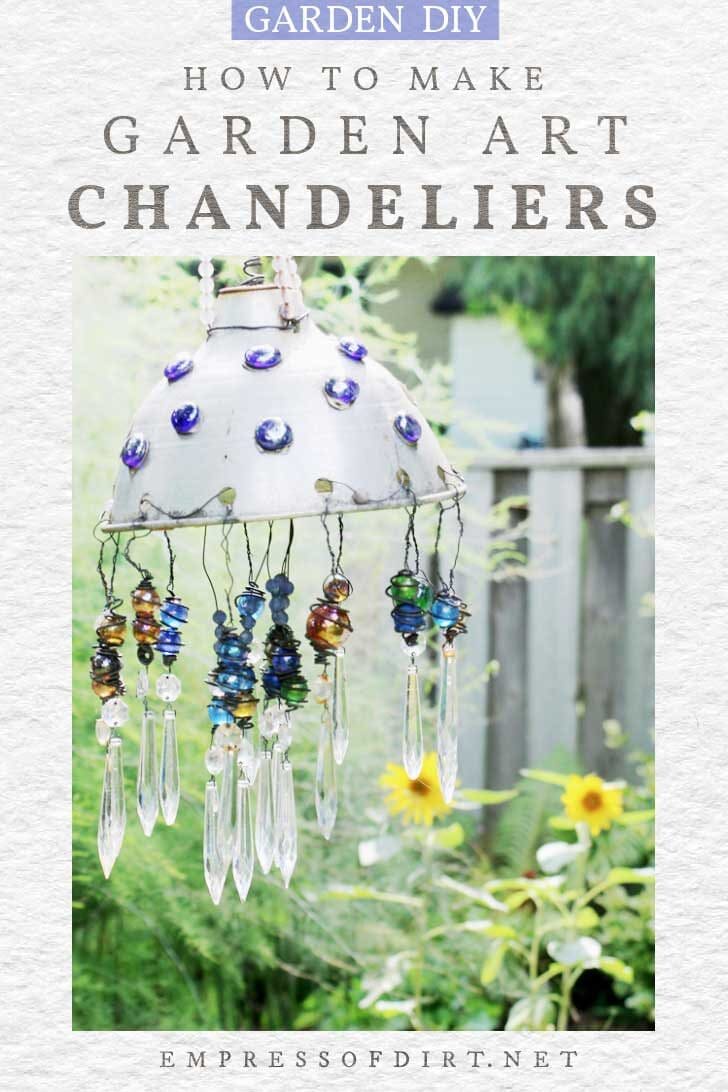 Upcycled garden art chandelier with marbles and crystals.