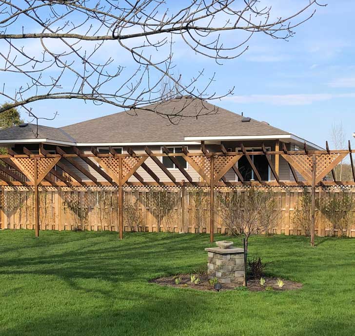 Fence privacy extension made from lattice panels. 