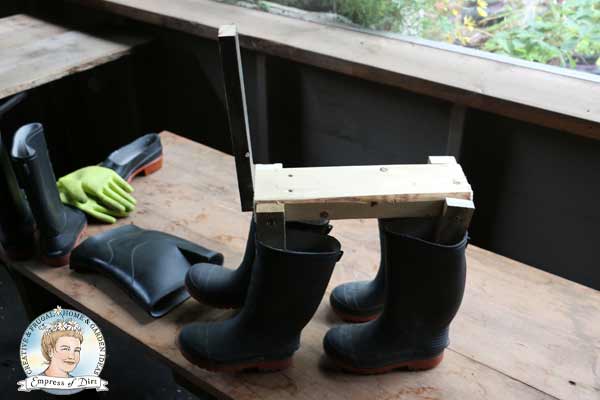 Boot dog frame with four rubber boots for legs. 