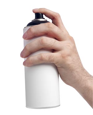 Hand hold spray paint can.
